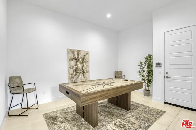 a bedroom with a bed and a night stand