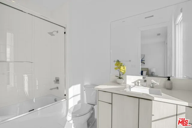 an aerial view of a house with a yard basket ball court