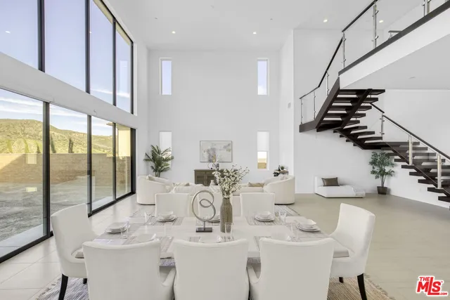 a kitchen with a table and chairs in it