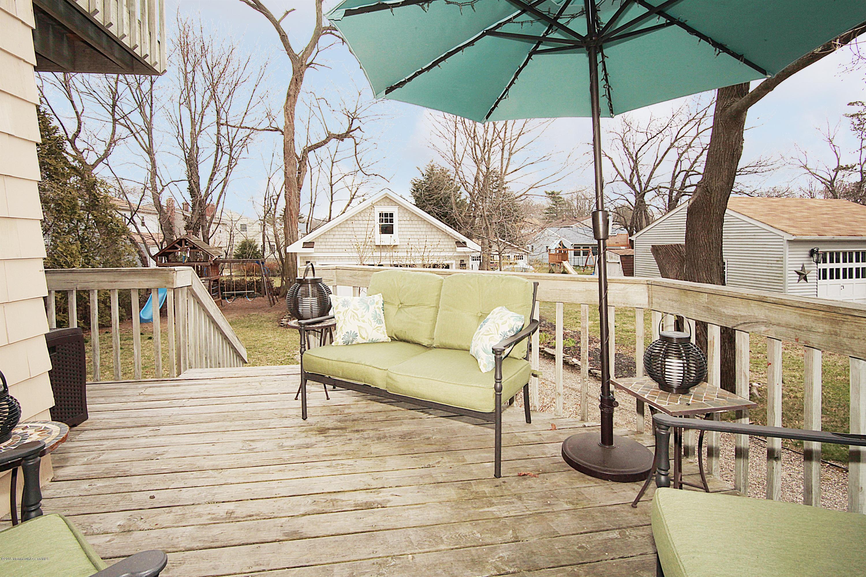 83 Ave Of Two Rivers Rumson, NJ 07760 - Photo 23 of 25 Rear deck overlooking the yard