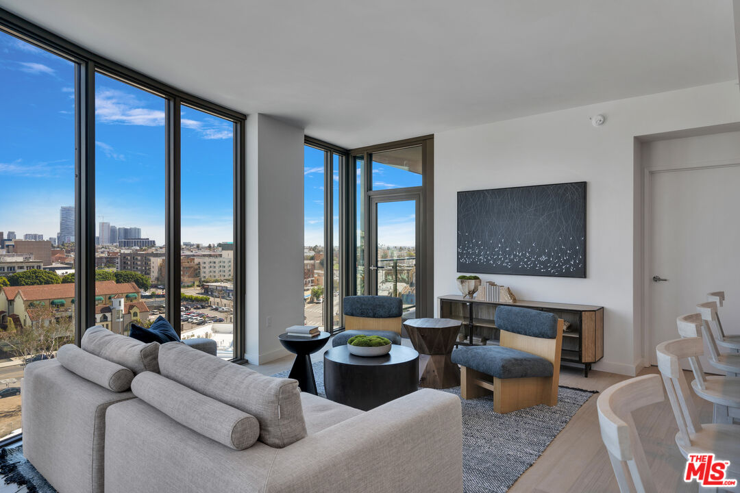 2801 Sunset Place, Unit 1911 Los Angeles, CA 90005 - Photo 16 of 18 a living room with furniture and a large window