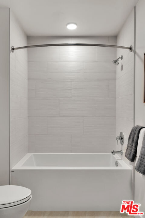 2801 Sunset Place, Unit 1911 Los Angeles, CA 90005 - Photo 8 of 18 a bathroom with a bathtub and a shower