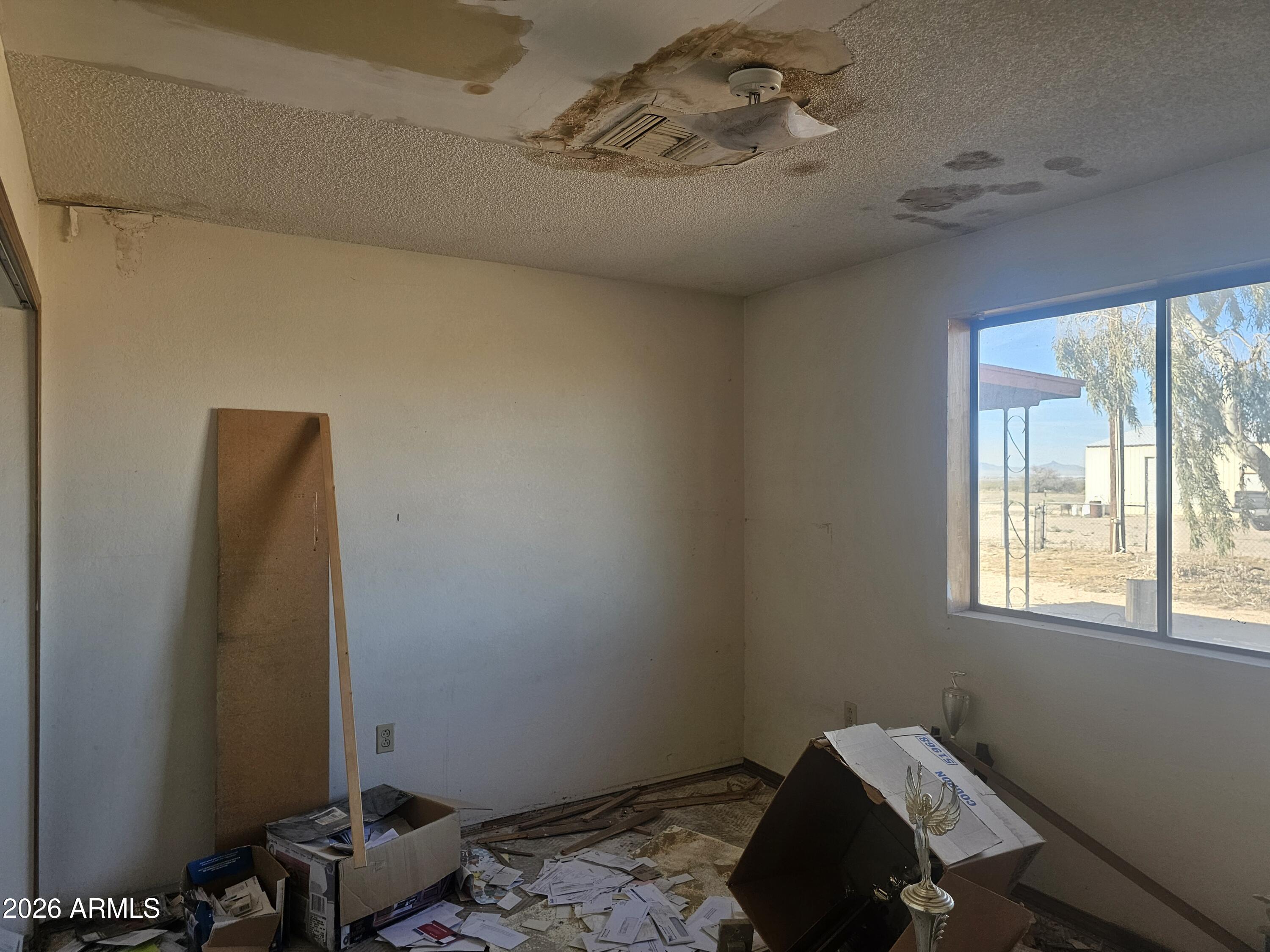 3613 North Papoose Road Casa Grande, AZ 85193 - Photo 15 of 19 a bedroom with a bed and a window