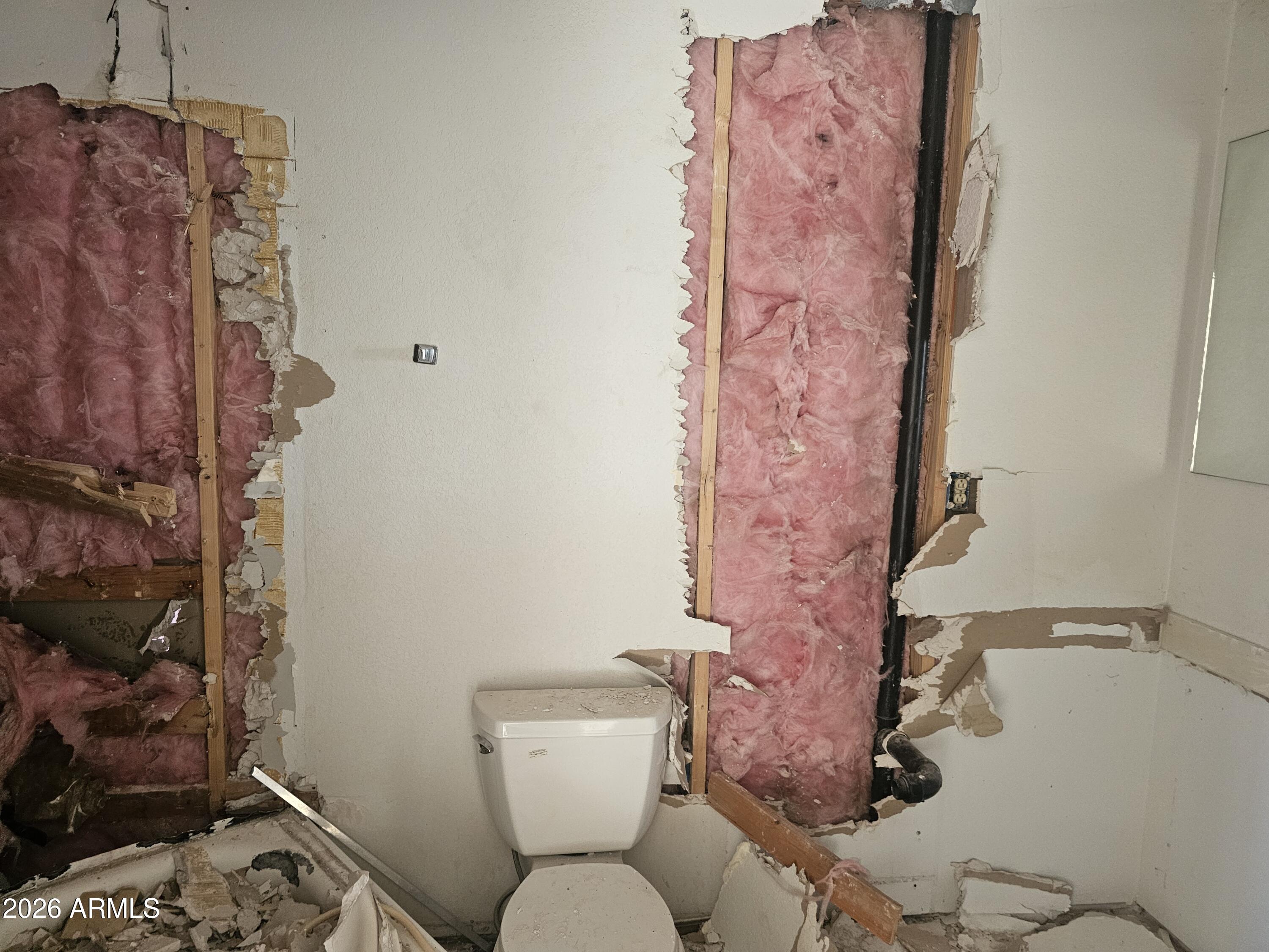 3613 North Papoose Road Casa Grande, AZ 85193 - Photo 18 of 19 a white toilet sitting next to a bathroom sink
