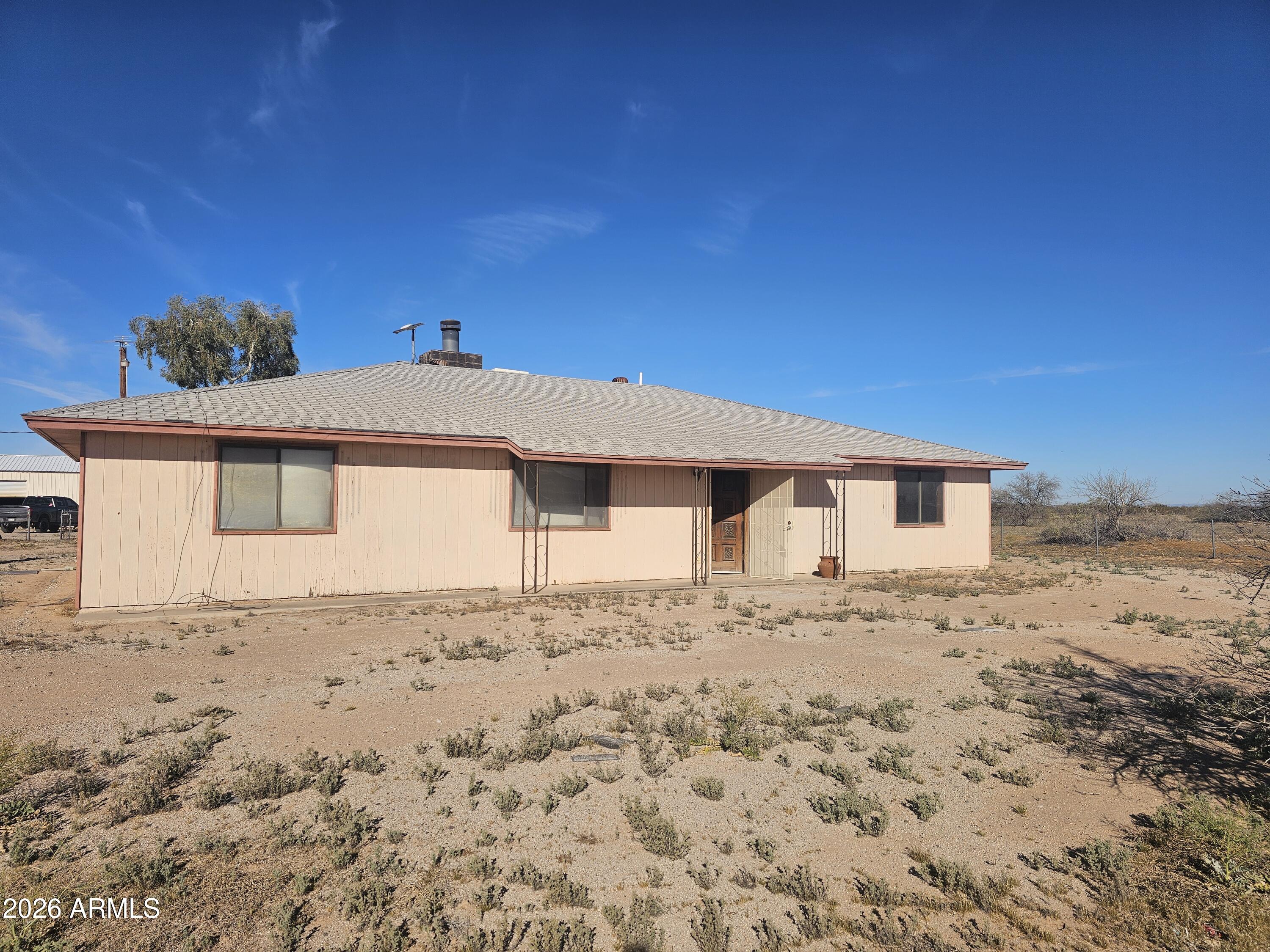 3613 North Papoose Road Casa Grande, AZ 85193 - Photo 2 of 19 a front view of a house with a yard