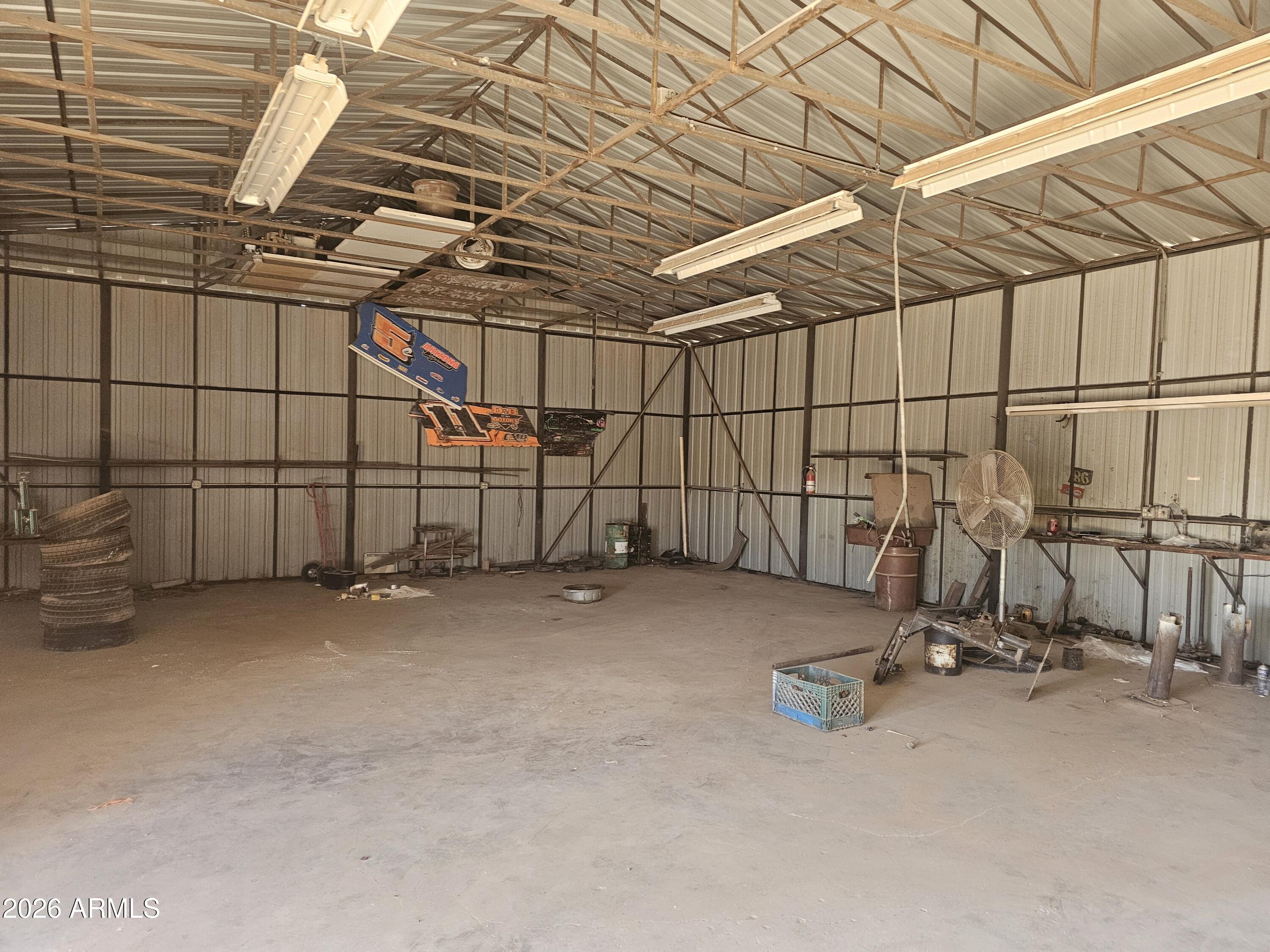 3613 North Papoose Road Casa Grande, AZ 85193 - Photo 6 of 19 a view of a room with racks on the wall
