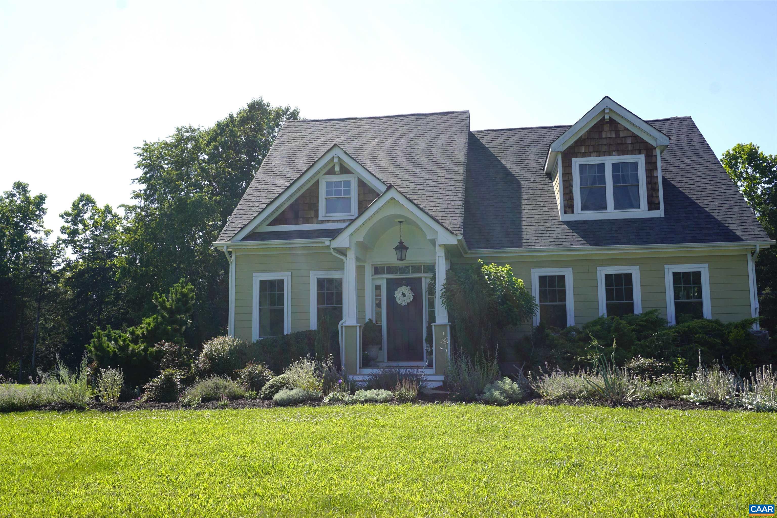 266 Ridgeview Drive Ruckersville, VA 22968 - Photo 2 of 20 a view of a house with a yard and plants