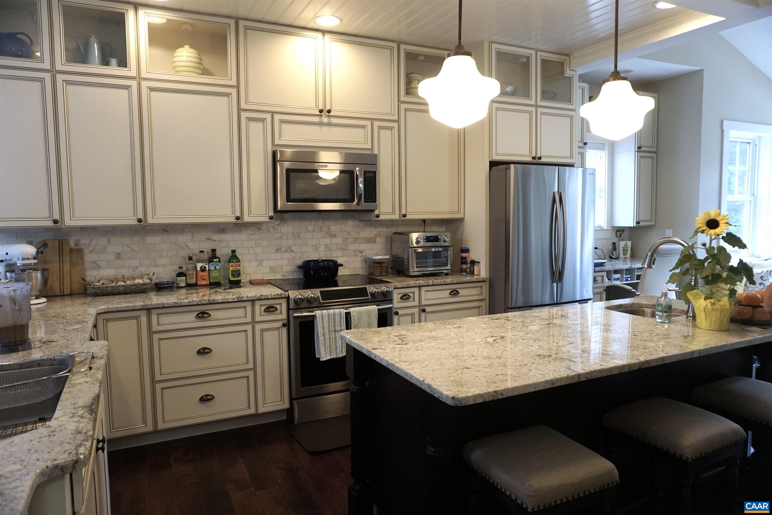 266 Ridgeview Drive Ruckersville, VA 22968 - Photo 5 of 20 a kitchen with granite countertop a sink cabinets and wooden floor
