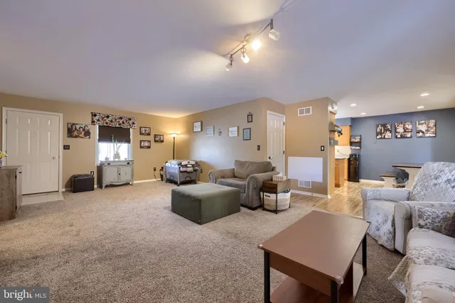 a kitchen with stainless steel appliances a stove a sink and a refrigerator