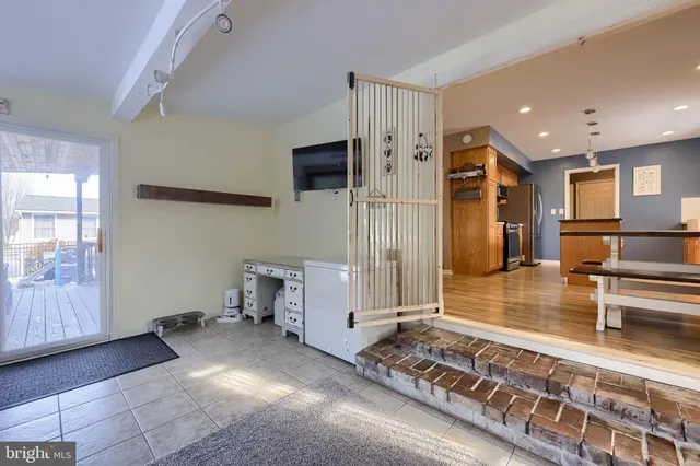 a living room with furniture and large windows
