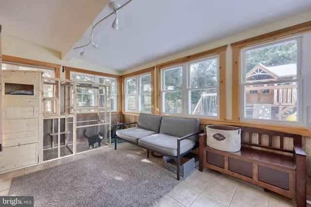 a bedroom with a bed and a dresser in it