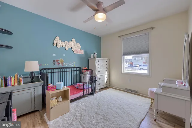 a view of a kitchen with cabinets and wooden floor