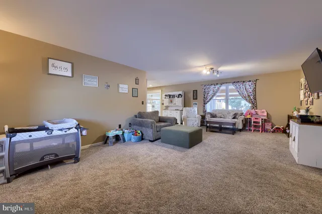 a living room with furniture and a table