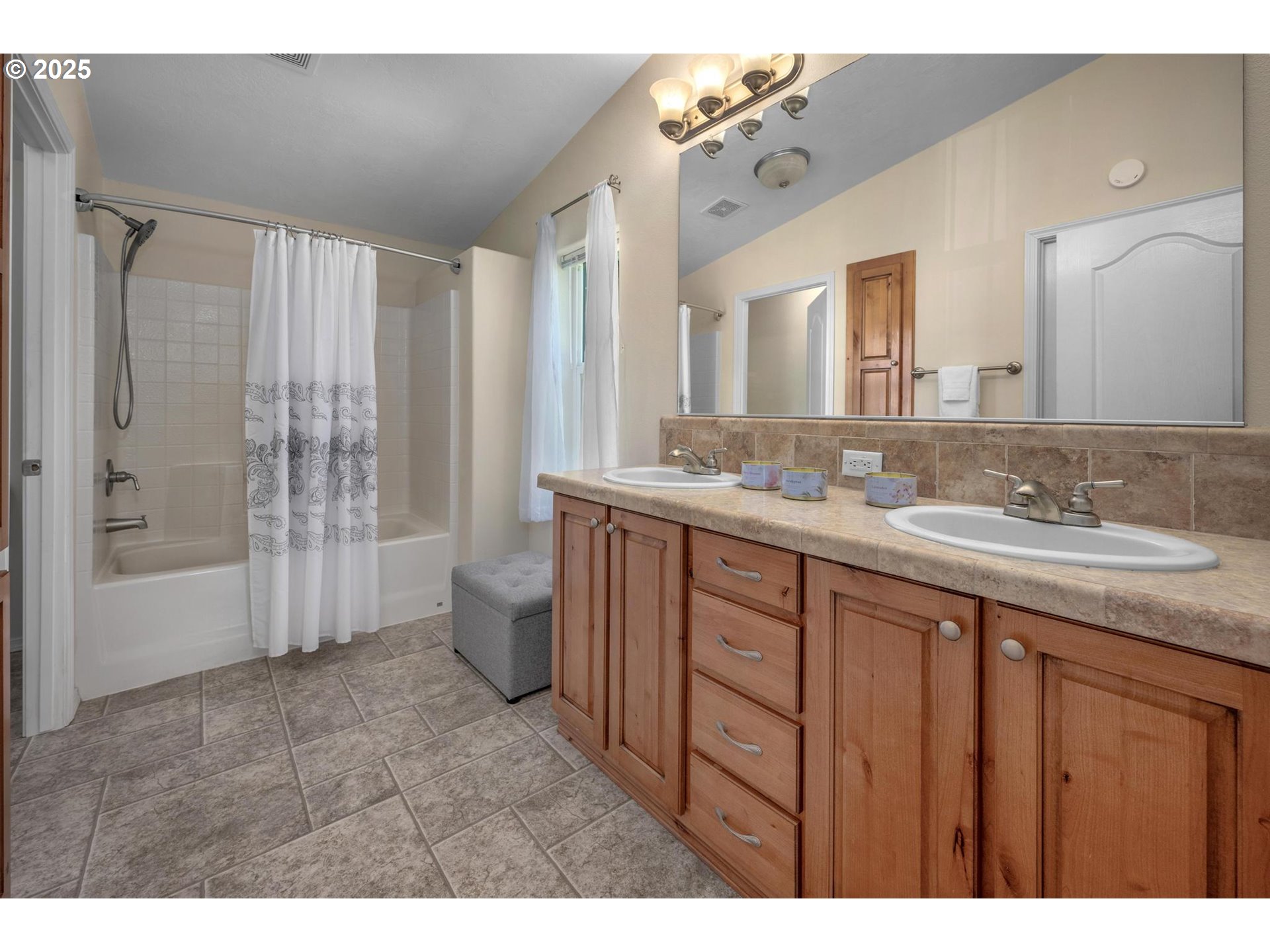 20270 Northwest Pihl Road Banks, OR 97106 - Photo 18 of 43 a spacious bathroom with a double vanity sink toilet and shower