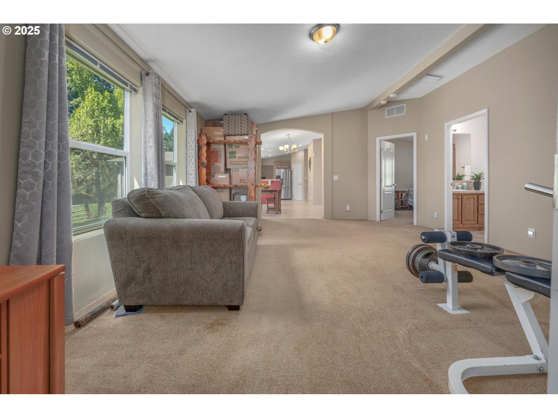 20270 Northwest Pihl Road Banks, OR 97106 - Photo 21 of 43 a living room with furniture and a flat screen tv