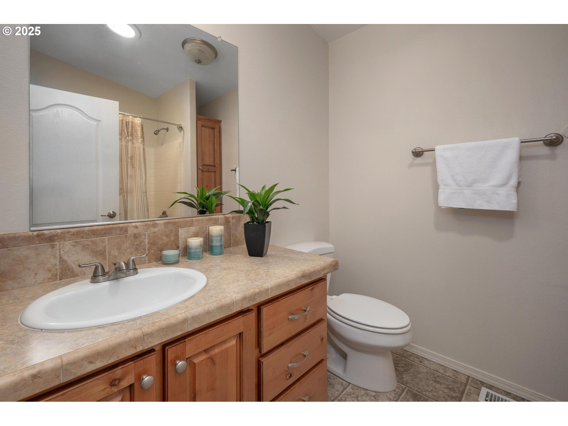 20270 Northwest Pihl Road Banks, OR 97106 - Photo 23 of 43 a bathroom with a granite countertop sink a toilet and mirror