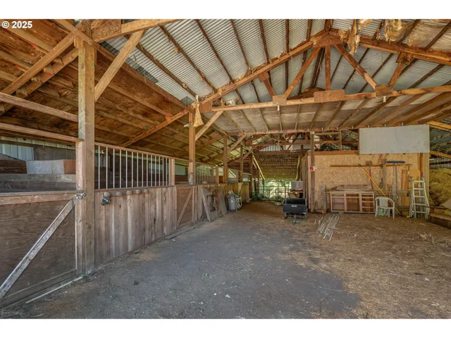 a view of an empty room with wooden walls