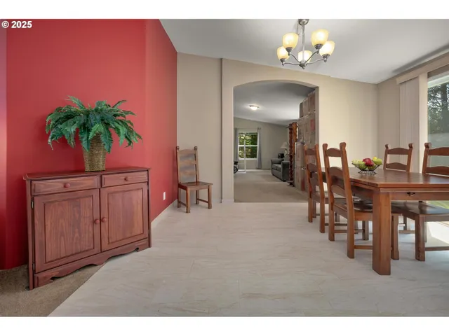 a view of a livingroom with furniture and a chandelier