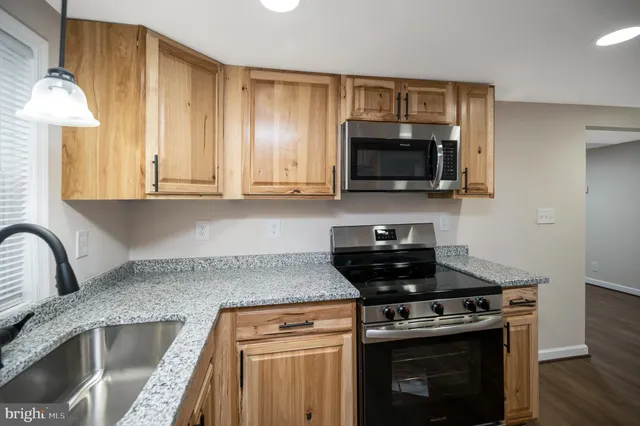 a kitchen with a stove and a microwave