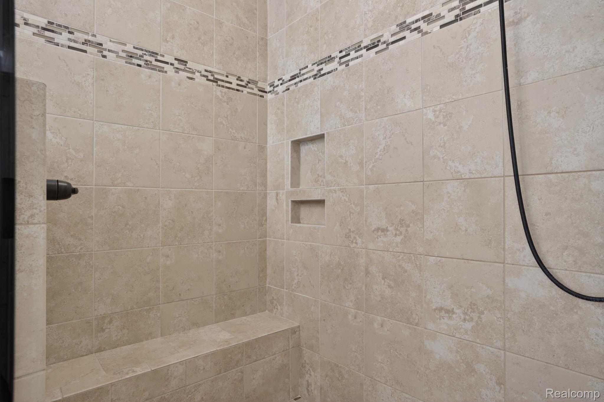 101 Highview Road Traverse City, MI 49696 - Photo 44 of 88 Bathroom featuring a tile shower