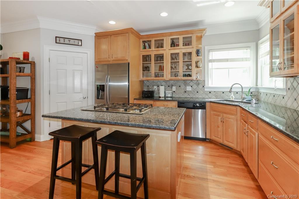 3458 Blue Jay Pass Fort Mill, SC 29708 - Photo 11 of 33 a kitchen with granite countertop a sink and cabinets