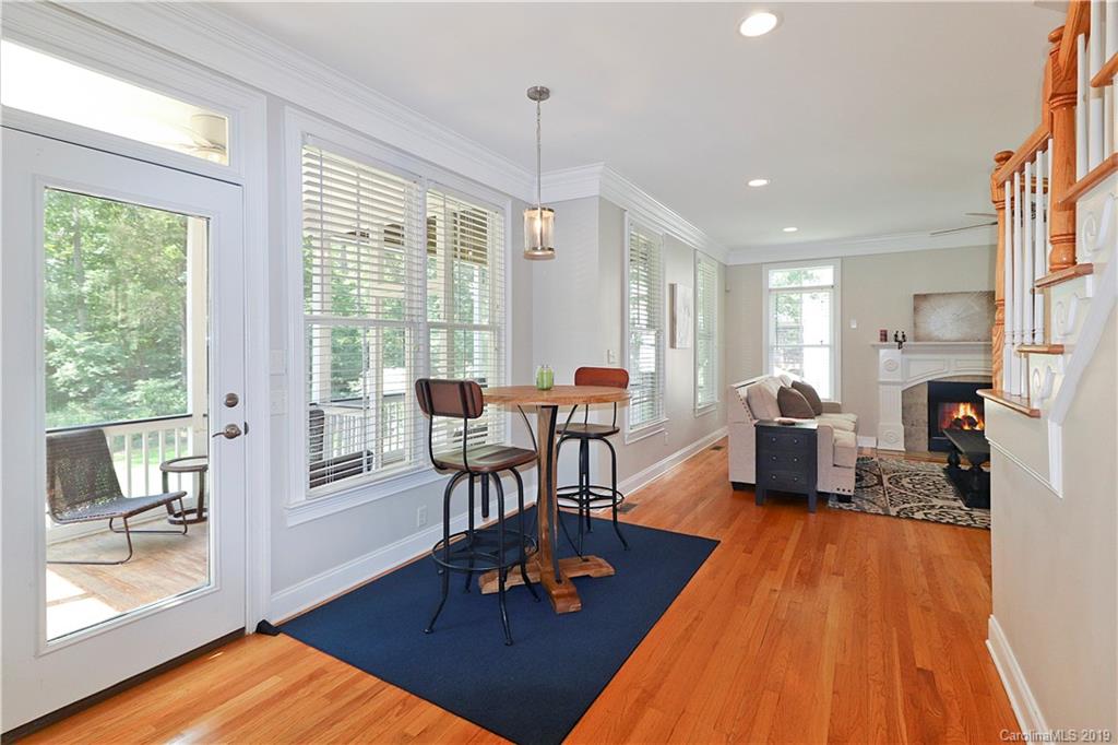 3458 Blue Jay Pass Fort Mill, SC 29708 - Photo 12 of 33 a living room with furniture a wooden floor and a large window