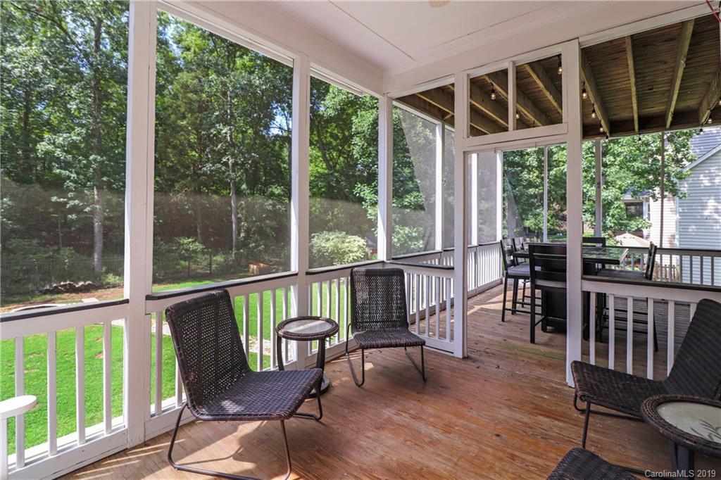 3458 Blue Jay Pass Fort Mill, SC 29708 - Photo 13 of 33 a view of a chair and table on the deck