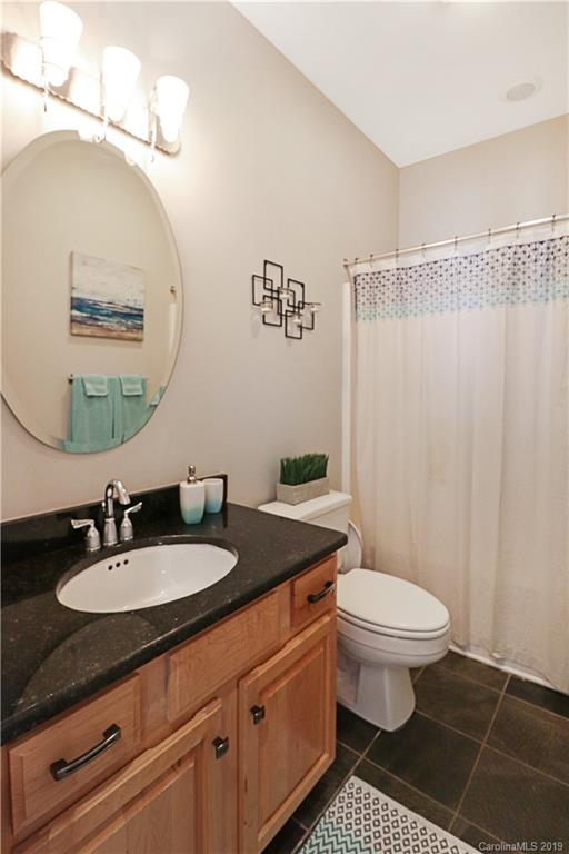 3458 Blue Jay Pass Fort Mill, SC 29708 - Photo 15 of 33 a bathroom with a granite countertop sink mirror vanity and toilet