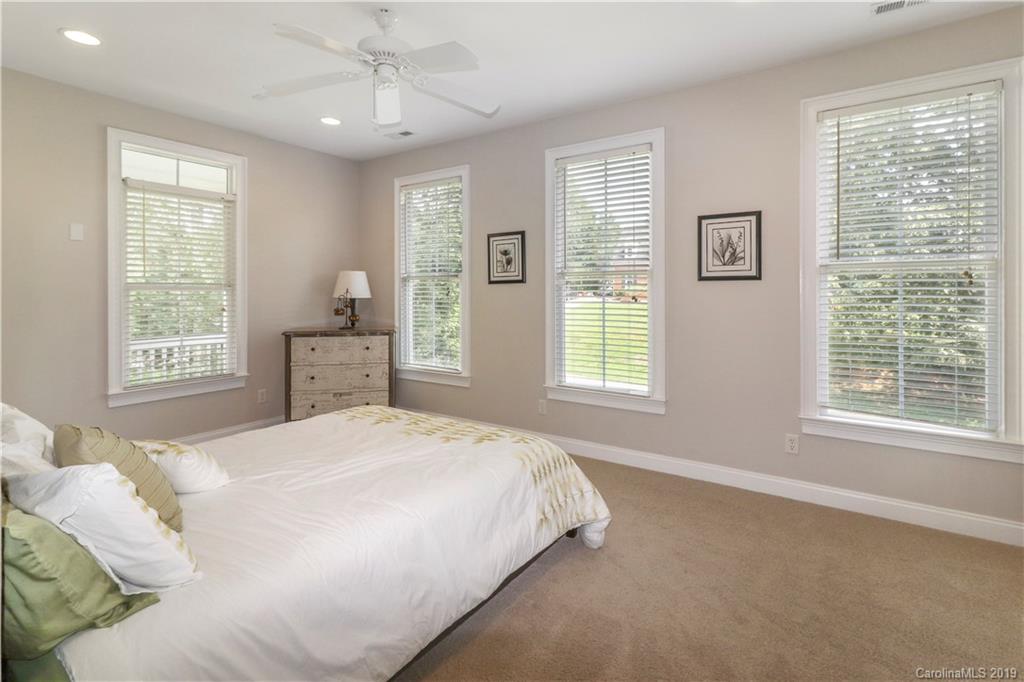 3458 Blue Jay Pass Fort Mill, SC 29708 - Photo 21 of 33 a bedroom with a large bed and a window