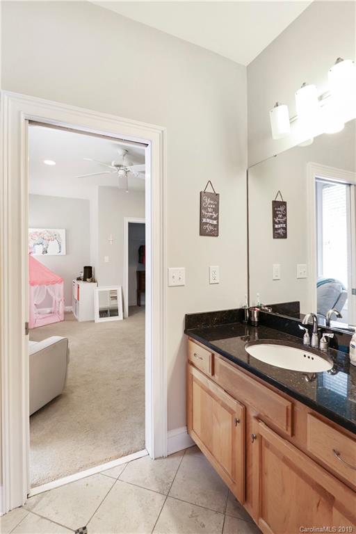 3458 Blue Jay Pass Fort Mill, SC 29708 - Photo 22 of 33 a spacious bathroom with a granite countertop sink a mirror and a