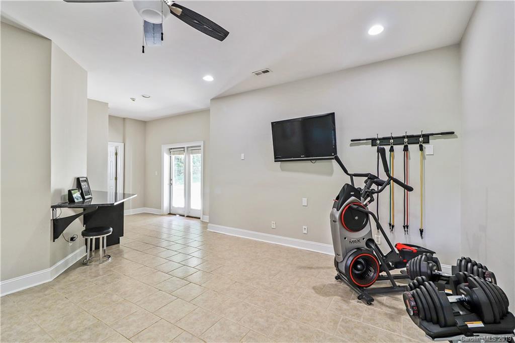 3458 Blue Jay Pass Fort Mill, SC 29708 - Photo 27 of 33 a view of a room with gym equipment