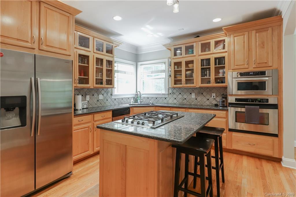 3458 Blue Jay Pass Fort Mill, SC 29708 - Photo 9 of 33 a kitchen with stainless steel appliances granite countertop a stove a sink and a refrigerator