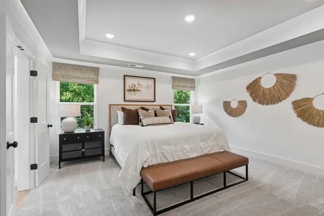 a bedroom with a bed couch and window