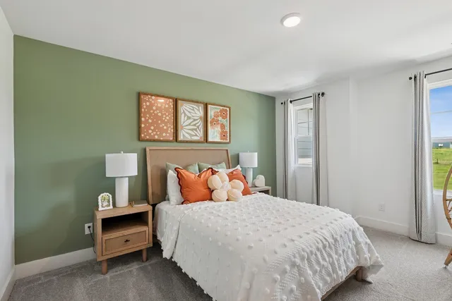 a bedroom with a bed and window