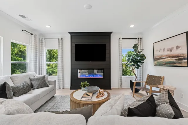 a living room with furniture and a fireplace