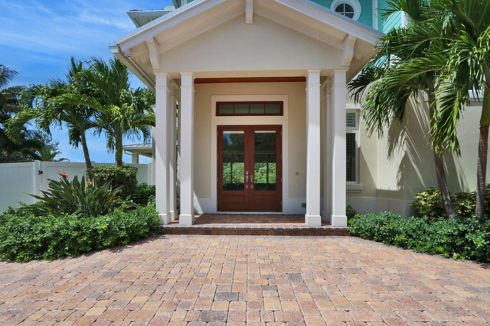 1304 Peninsular Road Jupiter, FL 33469 - Photo 2 of 67 a front view of a house with a yard