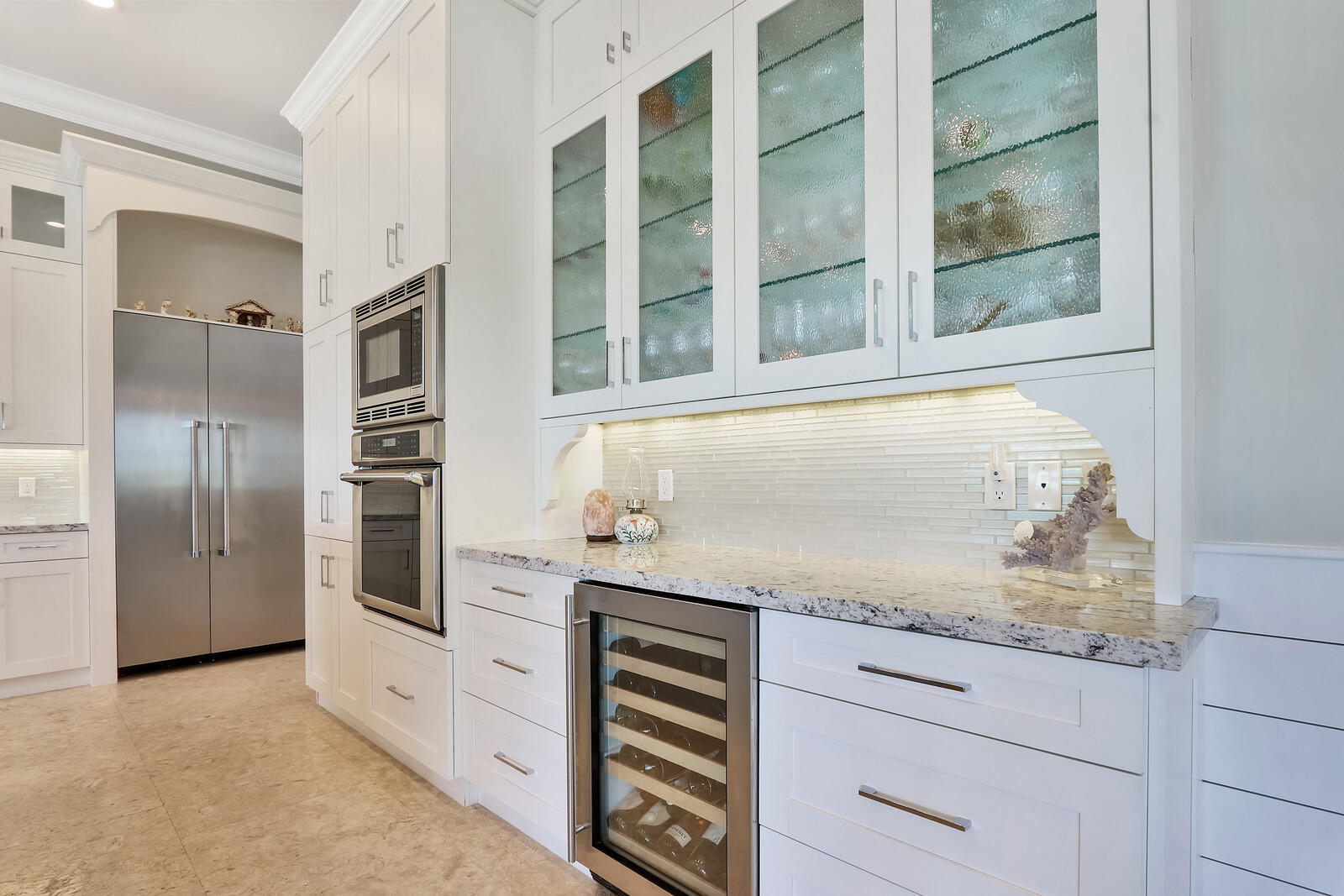 1304 Peninsular Road Jupiter, FL 33469 - Photo 11 of 67 a kitchen with granite countertop cabinets stainless steel appliances and a counter top space