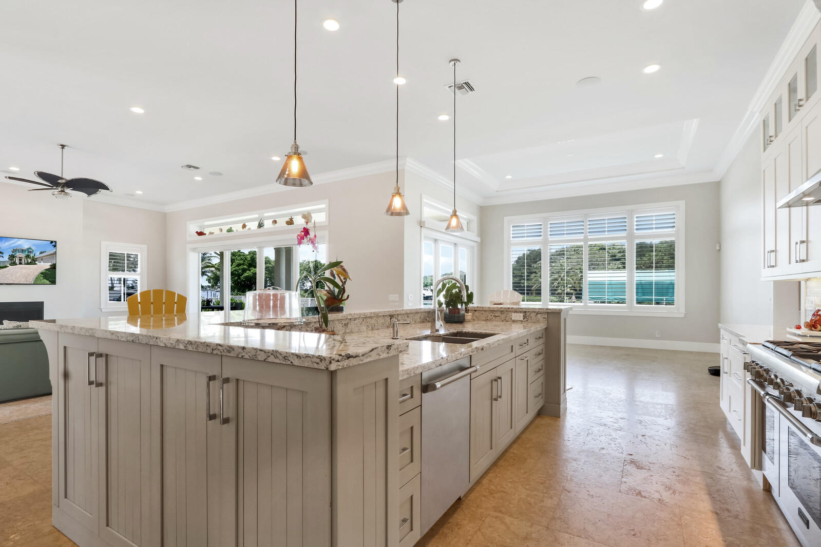 1304 Peninsular Road Jupiter, FL 33469 - Photo 15 of 67 a kitchen with counter top space sink stove and cabinets