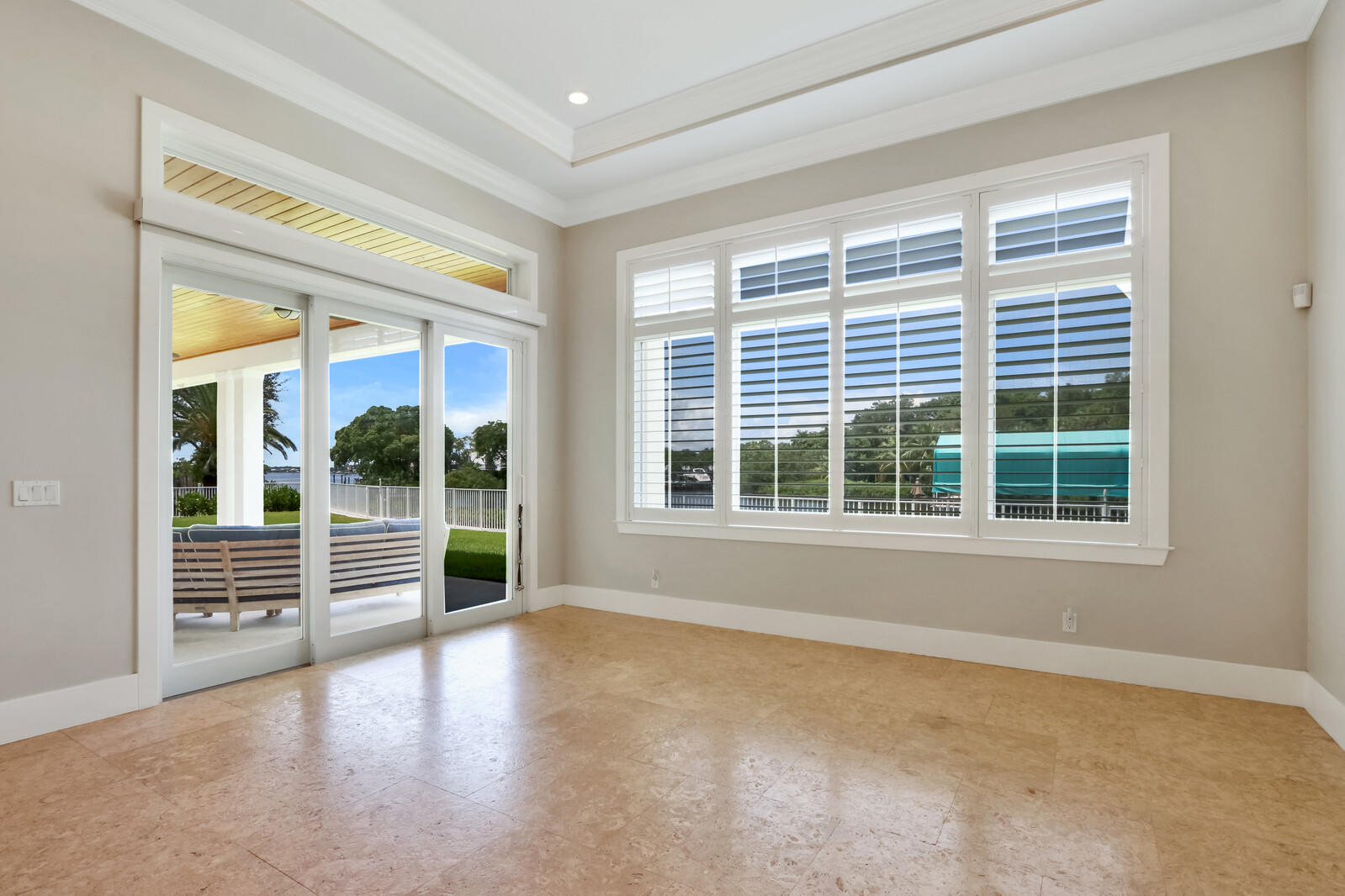 1304 Peninsular Road Jupiter, FL 33469 - Photo 16 of 67 an empty room with wooden floor and windows