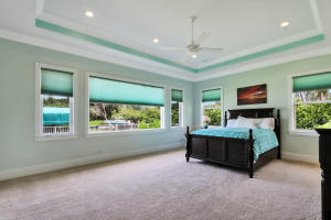 1304 Peninsular Road Jupiter, FL 33469 - Photo 19 of 67 a bed room with furniture and a window