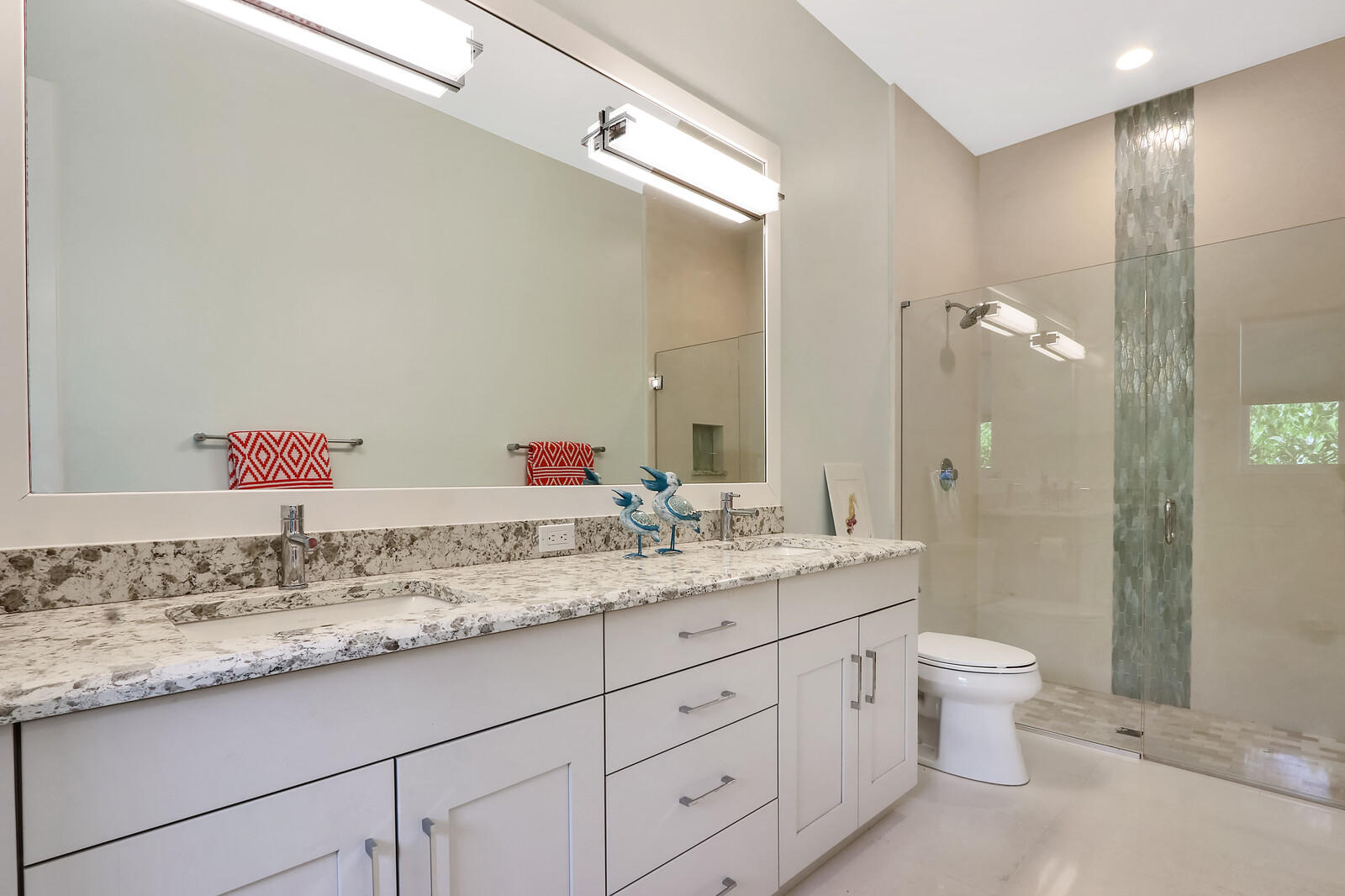1304 Peninsular Road Jupiter, FL 33469 - Photo 21 of 67 a bathroom with a granite countertop sink and a mirror