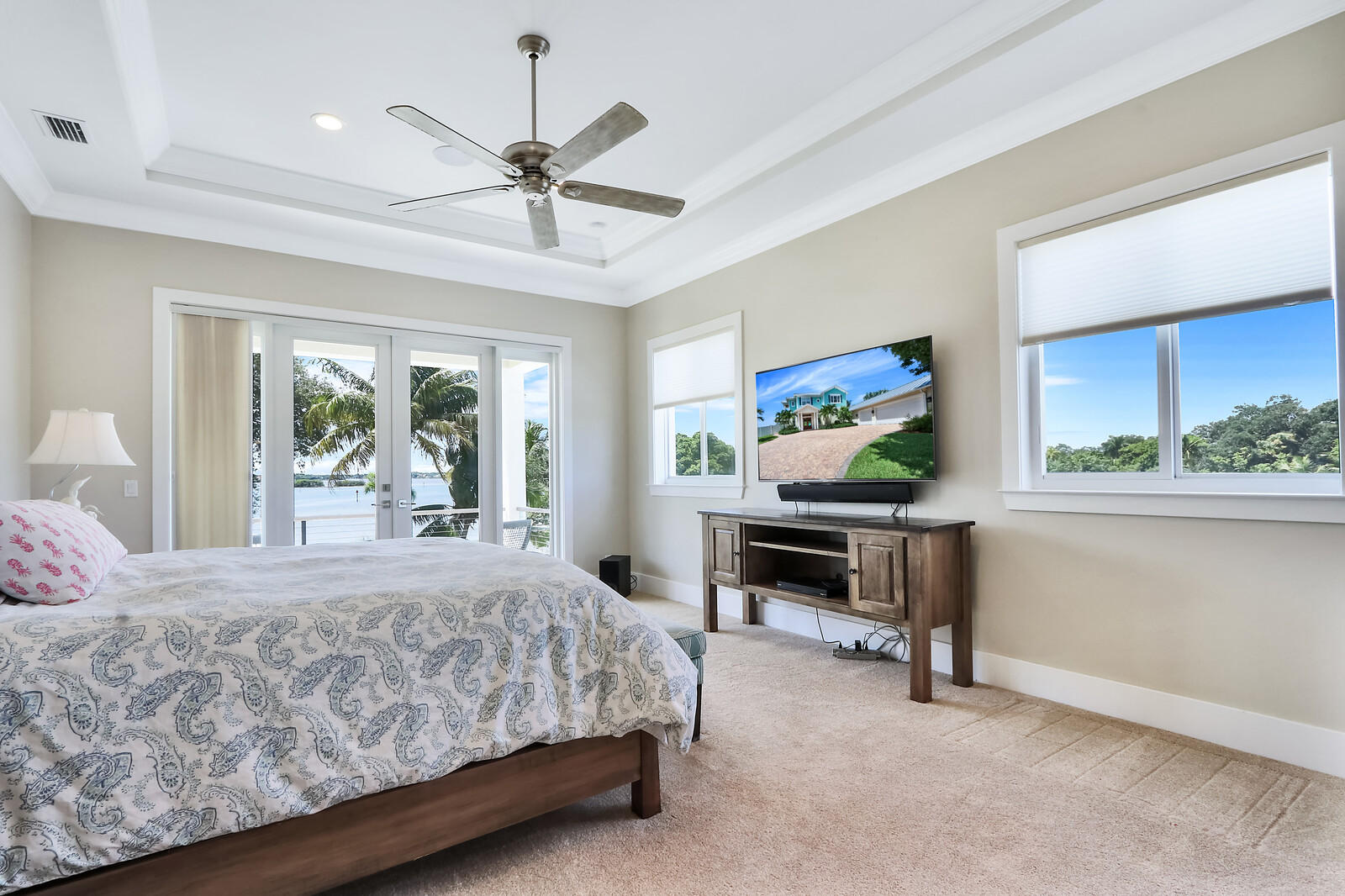 1304 Peninsular Road Jupiter, FL 33469 - Photo 26 of 67 a bedroom with a bed table two chairs and a window