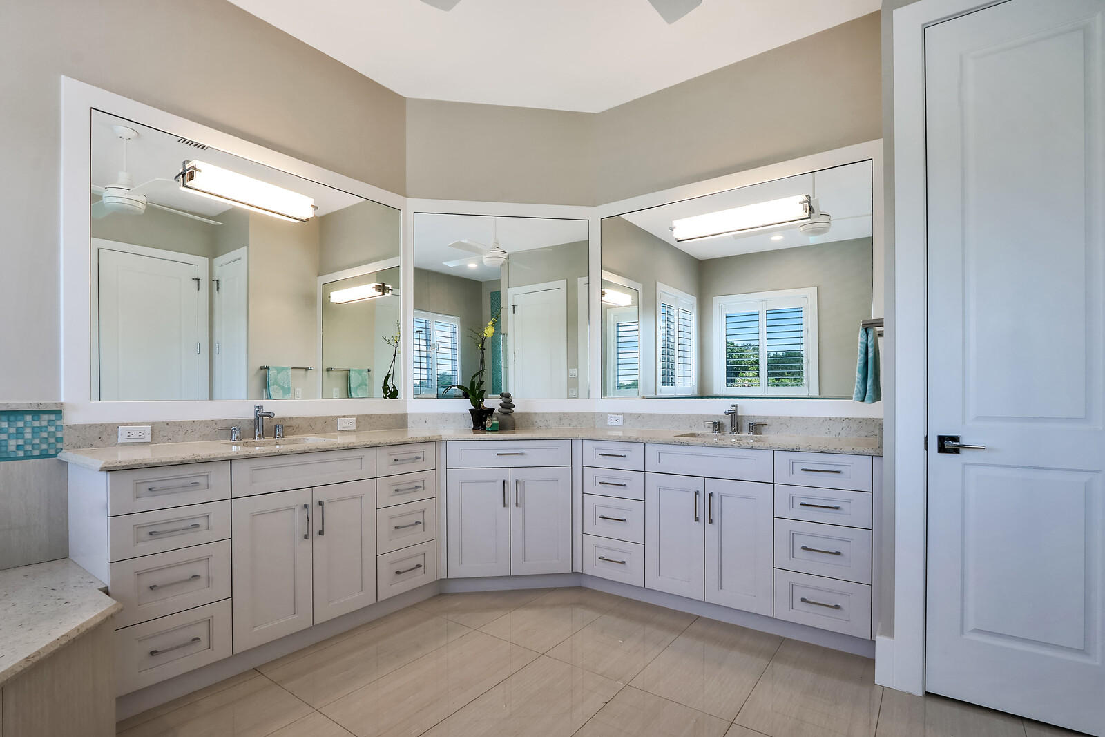 1304 Peninsular Road Jupiter, FL 33469 - Photo 32 of 67 a spacious bathroom with a granite countertop sink mirror and a