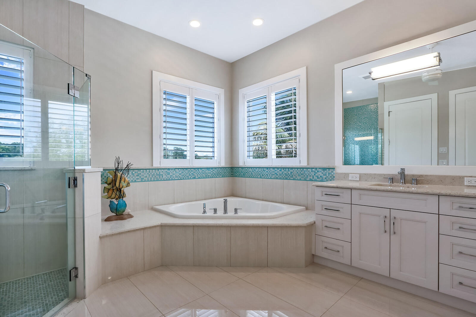 1304 Peninsular Road Jupiter, FL 33469 - Photo 34 of 67 a bathroom with a tub a sink a window and a shower