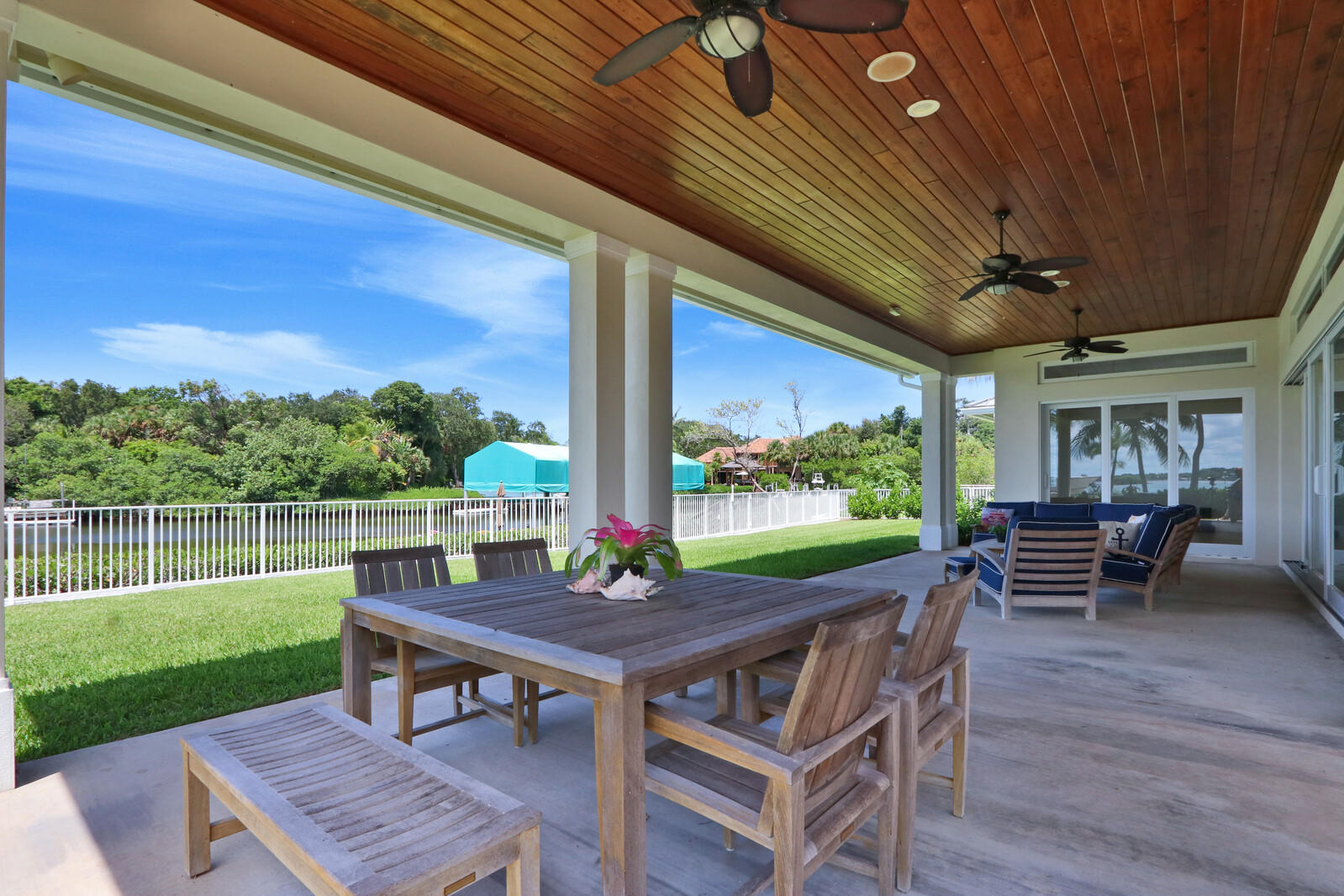 1304 Peninsular Road Jupiter, FL 33469 - Photo 42 of 67 a view of a dining room with furniture window and wooden floor