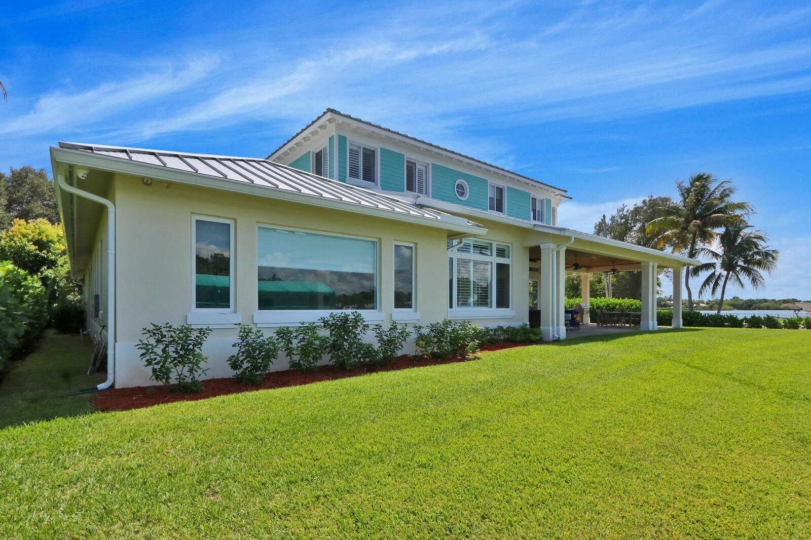 1304 Peninsular Road Jupiter, FL 33469 - Photo 47 of 67 a front view of a house with garden