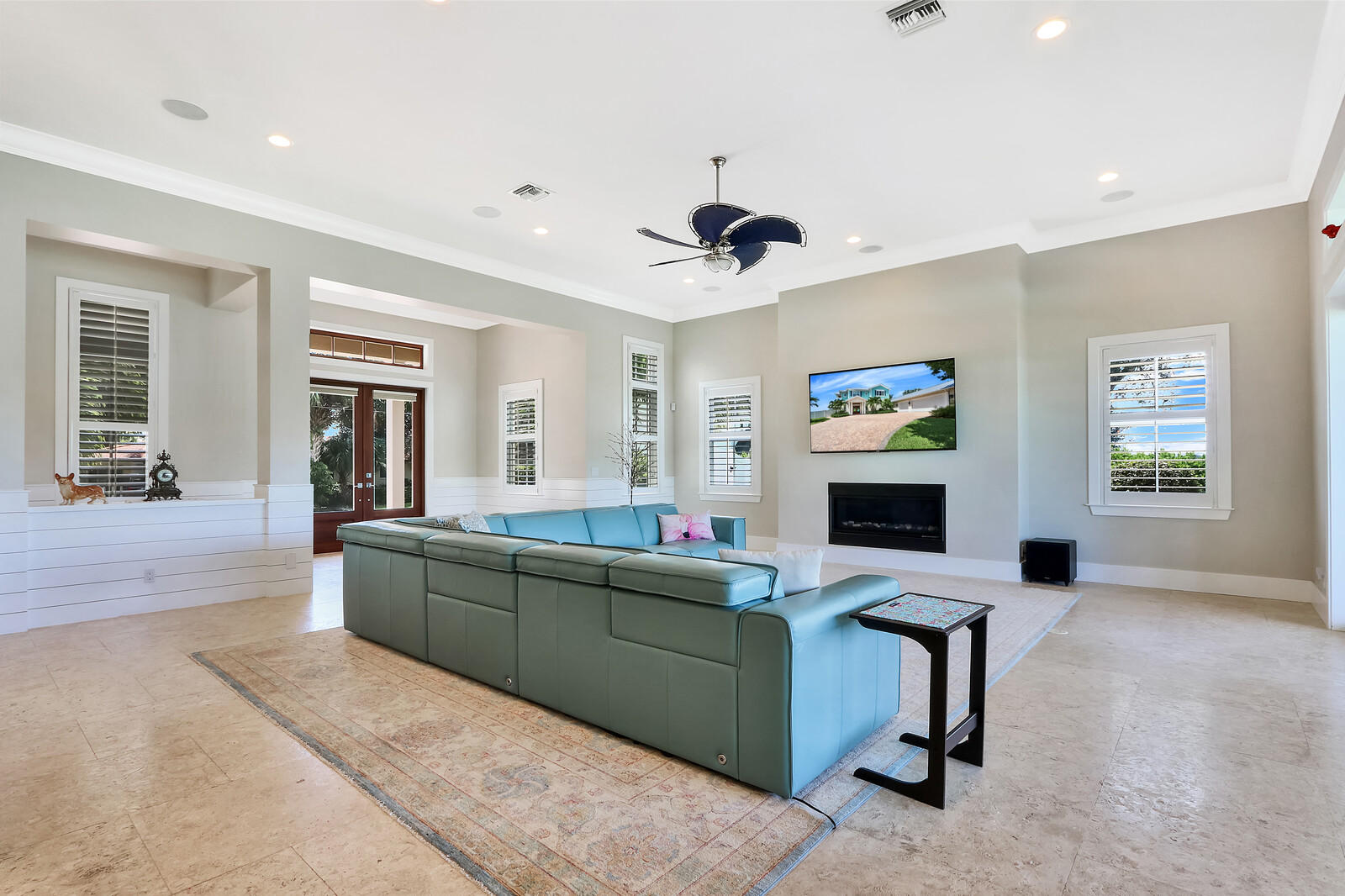 1304 Peninsular Road Jupiter, FL 33469 - Photo 6 of 67 a living room with furniture and a flat screen tv