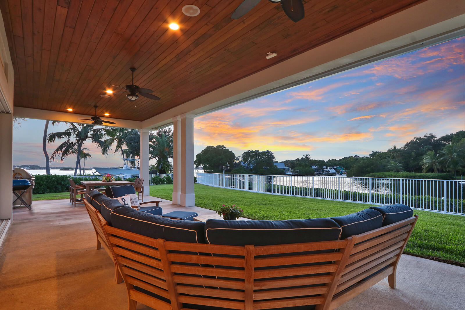 1304 Peninsular Road Jupiter, FL 33469 - Photo 60 of 67 a view of a patio with a table chairs and a yard