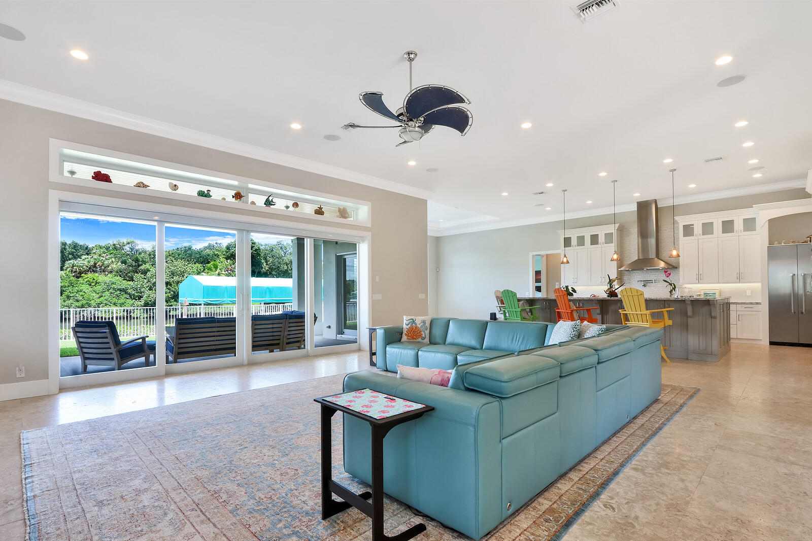 1304 Peninsular Road Jupiter, FL 33469 - Photo 8 of 67 a living room with furniture and a large window