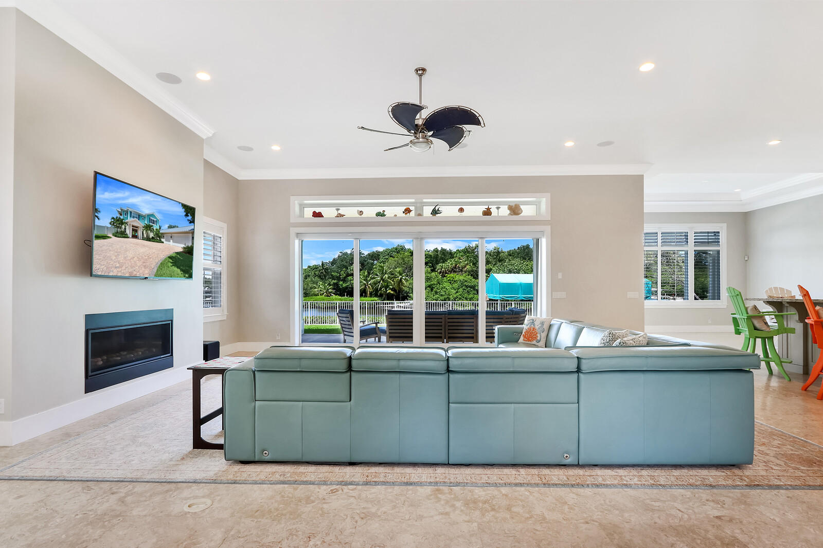 1304 Peninsular Road Jupiter, FL 33469 - Photo 9 of 67 a living room with furniture and a fireplace